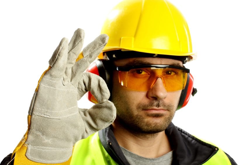 Worker with protective gear with thumbs up